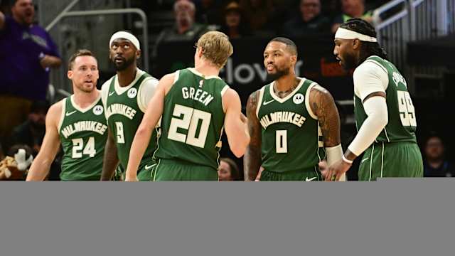 Milwaukee Bucks guard Damian Lillard (0) stands with teammates 